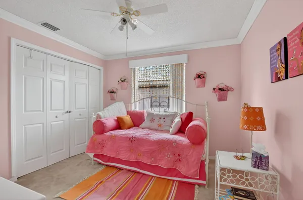 a bed room with a bed and a window