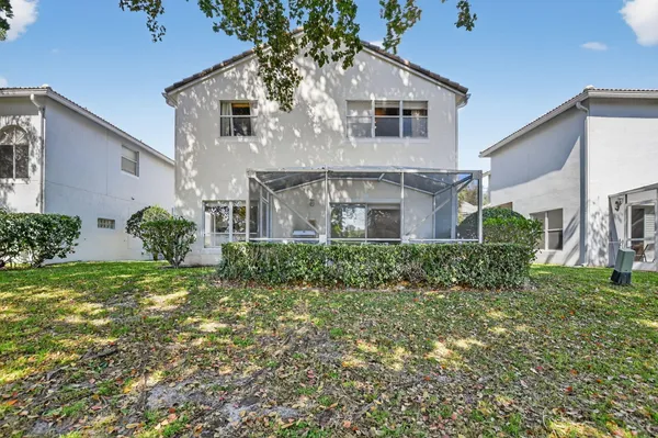 a view of yard with swimming pool and green space
