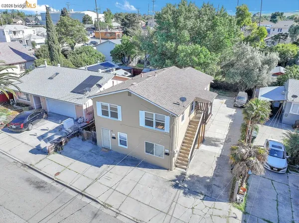 a aerial view of a house with a yard