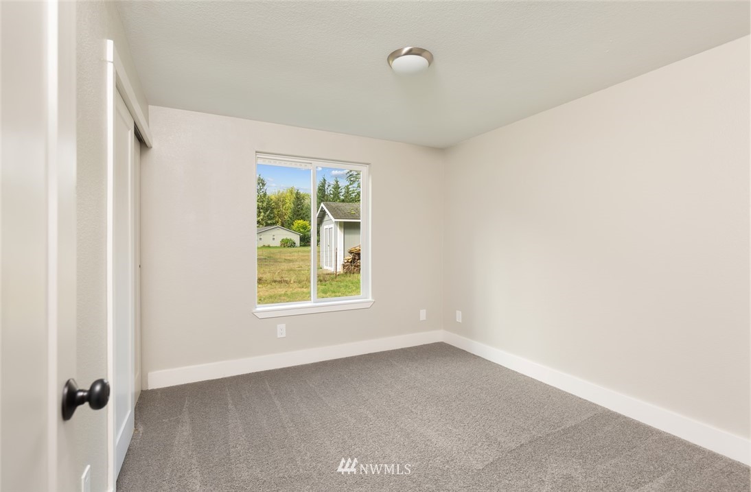 19129 Denmark Street Southwest Rochester, WA 98579 - Photo 13 of 21 an empty room with a window