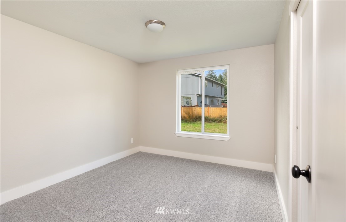 19129 Denmark Street Southwest Rochester, WA 98579 - Photo 14 of 21 an empty room with a window