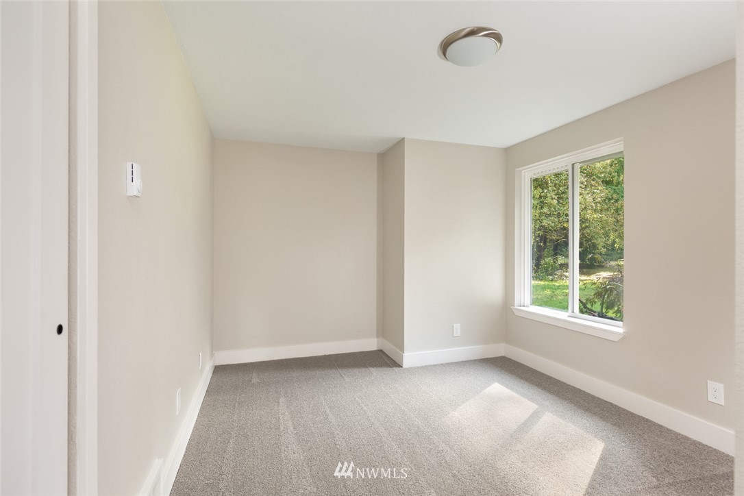 19129 Denmark Street Southwest Rochester, WA 98579 - Photo 15 of 21 an empty room with windows