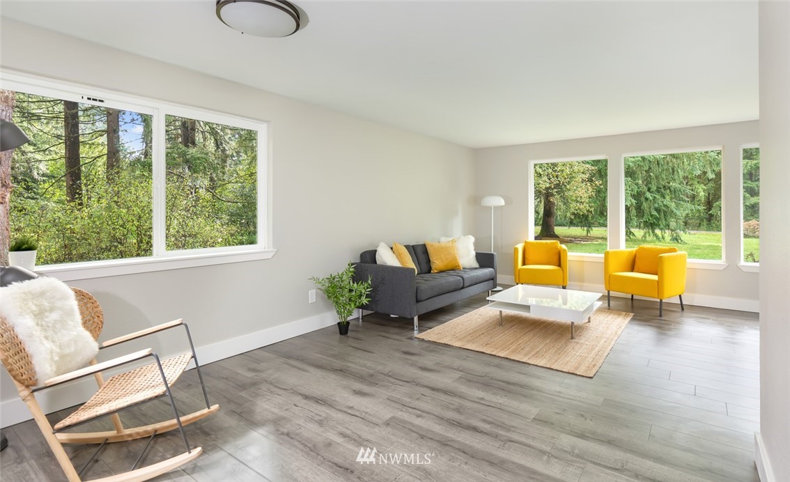 19129 Denmark Street Southwest Rochester, WA 98579 - Photo 5 of 21 a living room with furniture and a large window