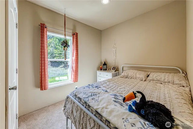 a bedroom with a bed and a dresser