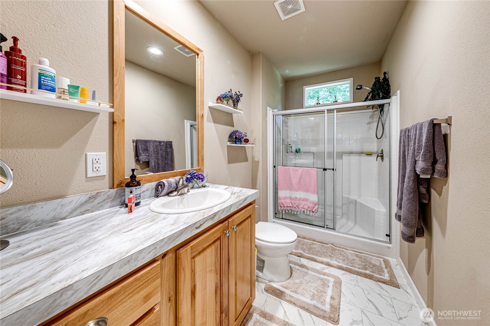 51 Sunflower Road Port Angeles, WA 98363 - Photo 19 of 40 a bathroom with a sink a toilet and shower