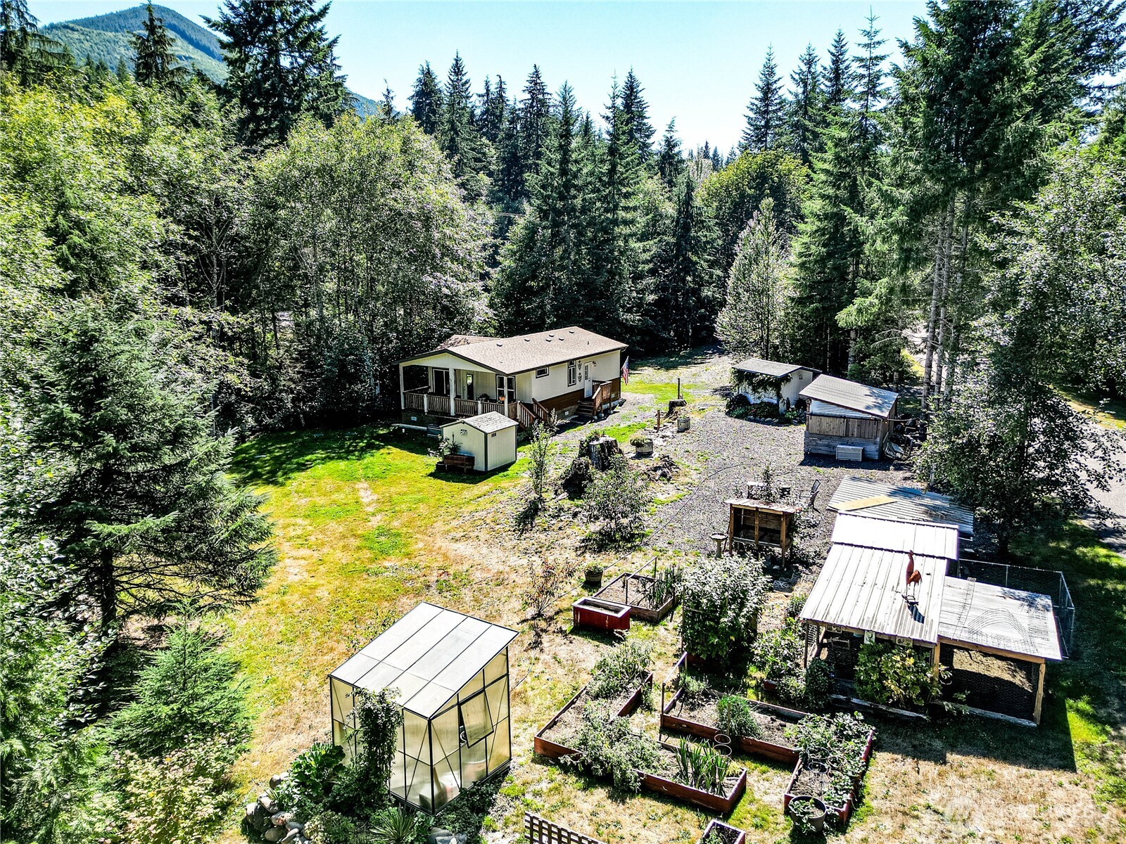 51 Sunflower Road Port Angeles, WA 98363 - Photo 33 of 40 an aerial view of a house with swimming pool and patio
