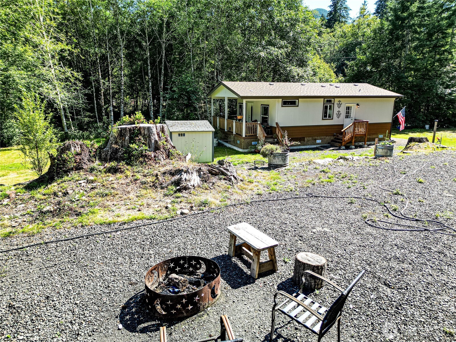 51 Sunflower Road Port Angeles, WA 98363 - Photo 34 of 40 a view of a patio with furniture and a yard