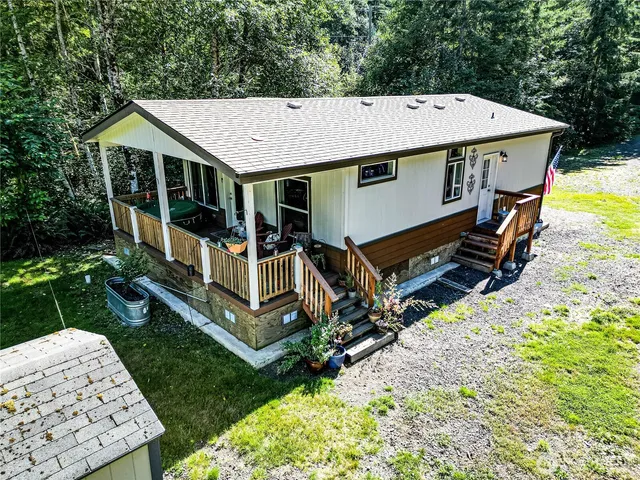 a view of backyard with swimming pool and patio