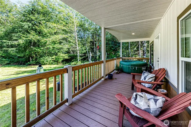 a view of balcony with furniture and garden