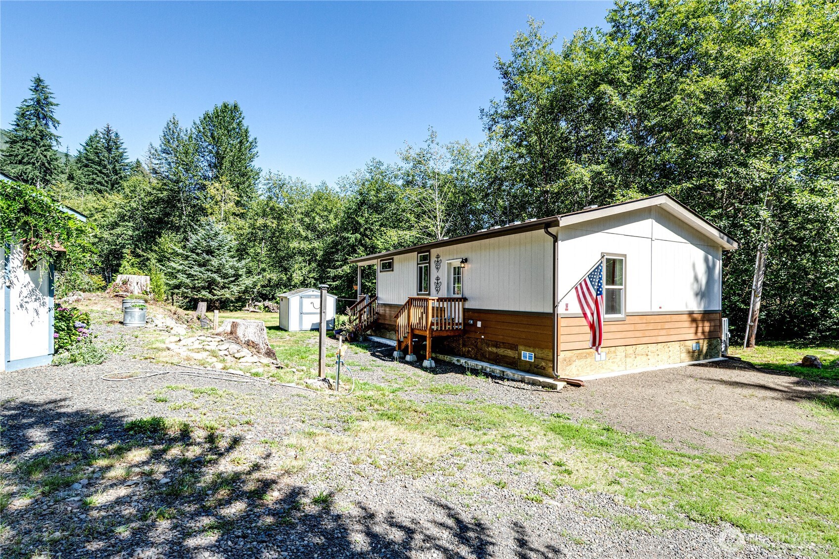51 Sunflower Road Port Angeles, WA 98363 - Photo 8 of 40 a view of a house with a yard and sitting area
