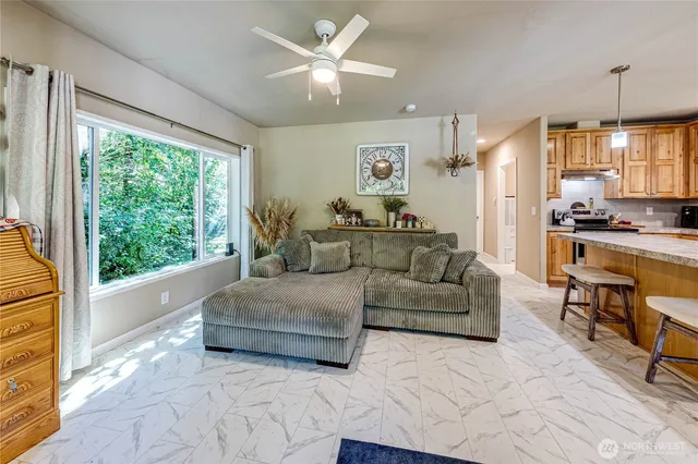 a living room with furniture and a large window
