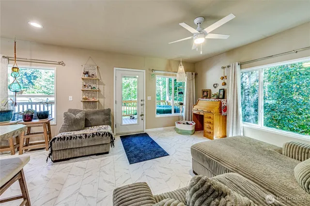 a living room with furniture and a large window
