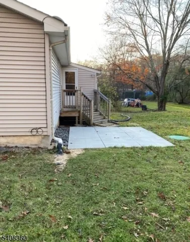 a view of a backyard of the house