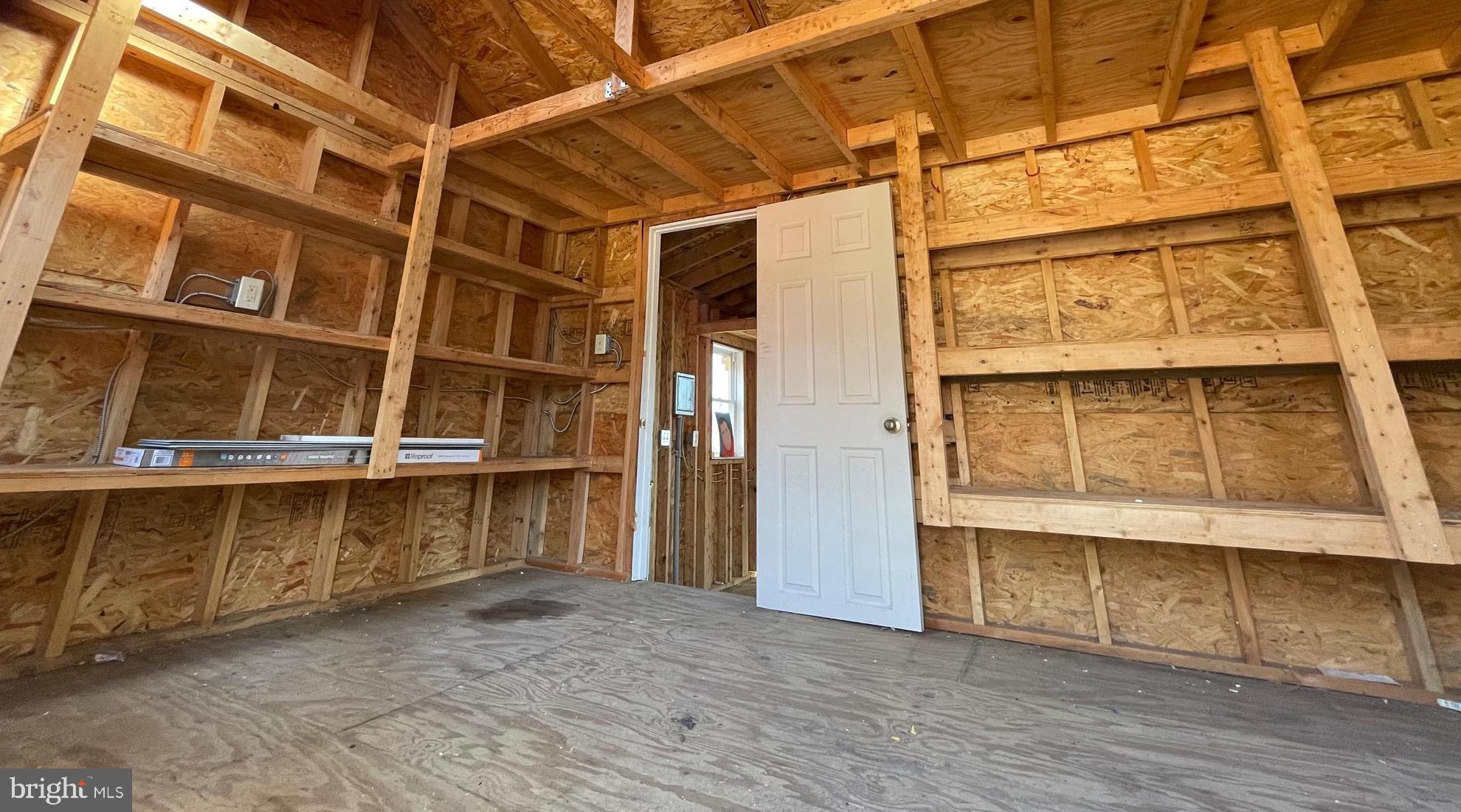 6107 Buckler Road Clinton, MD 20735 - Photo 43 of 45 a view of an empty room with wooden floor and a window