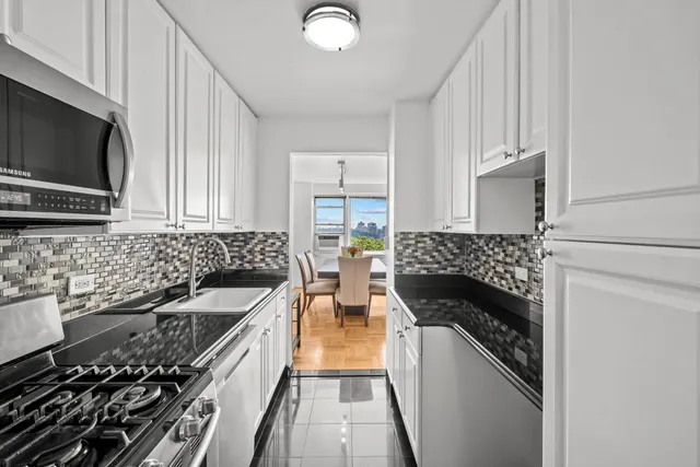 a kitchen with a stove and a microwave