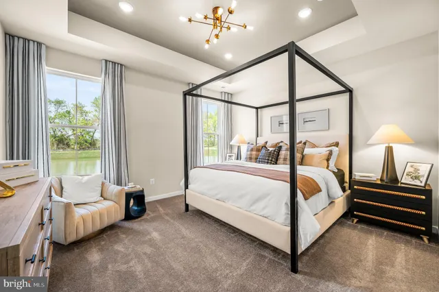 a bed room with bed and window