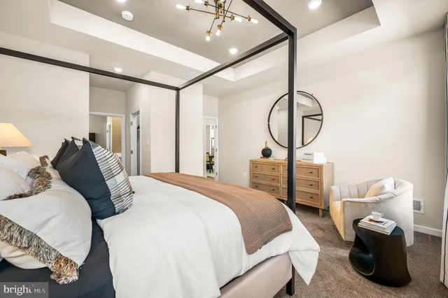 a view of walk in closet with wooden floor
