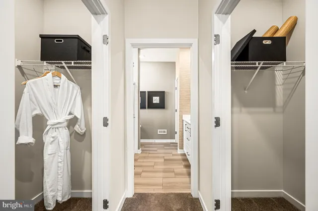 a bathroom with a double vanity sink a mirror and shower