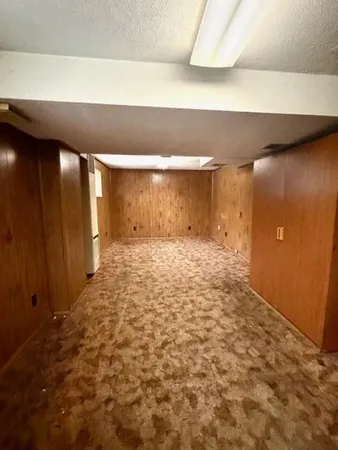 a view of a hallway with a refrigerator