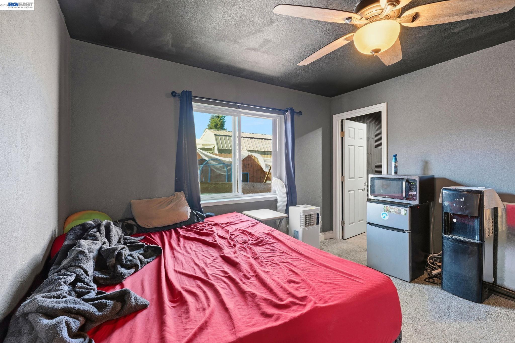 10378 South Priest Road French Camp, CA 95231 - Photo 13 of 44 a bedroom with a bed and a television