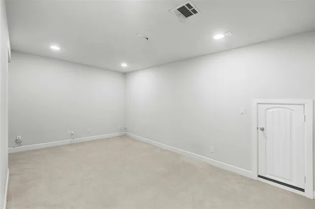 an empty room with a ceiling fan
