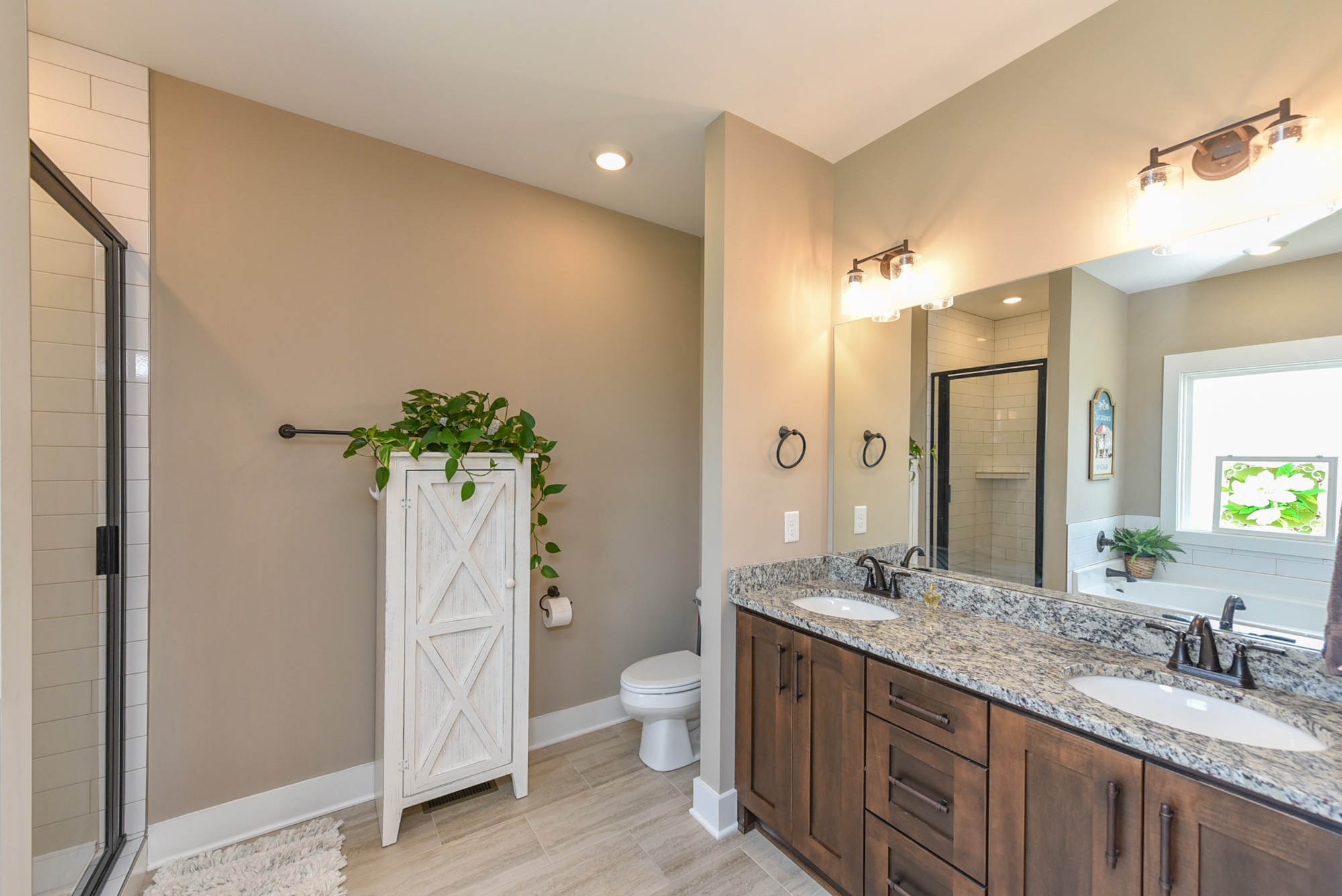 4817 Barren Plains Road Springfield, TN 37172 - Photo 12 of 31 a spacious bathroom with a granite countertop sink a toilet and a large mirror
