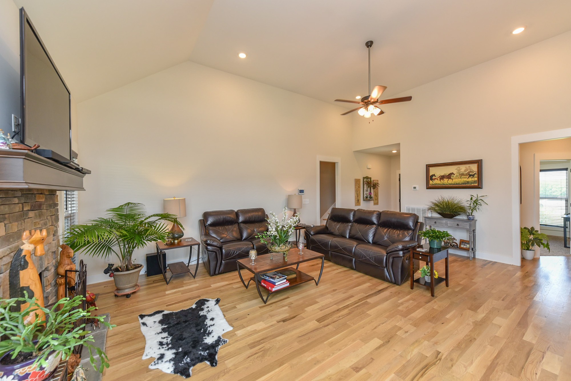 4817 Barren Plains Road Springfield, TN 37172 - Photo 7 of 31 a living room with furniture a fireplace and a flat screen tv