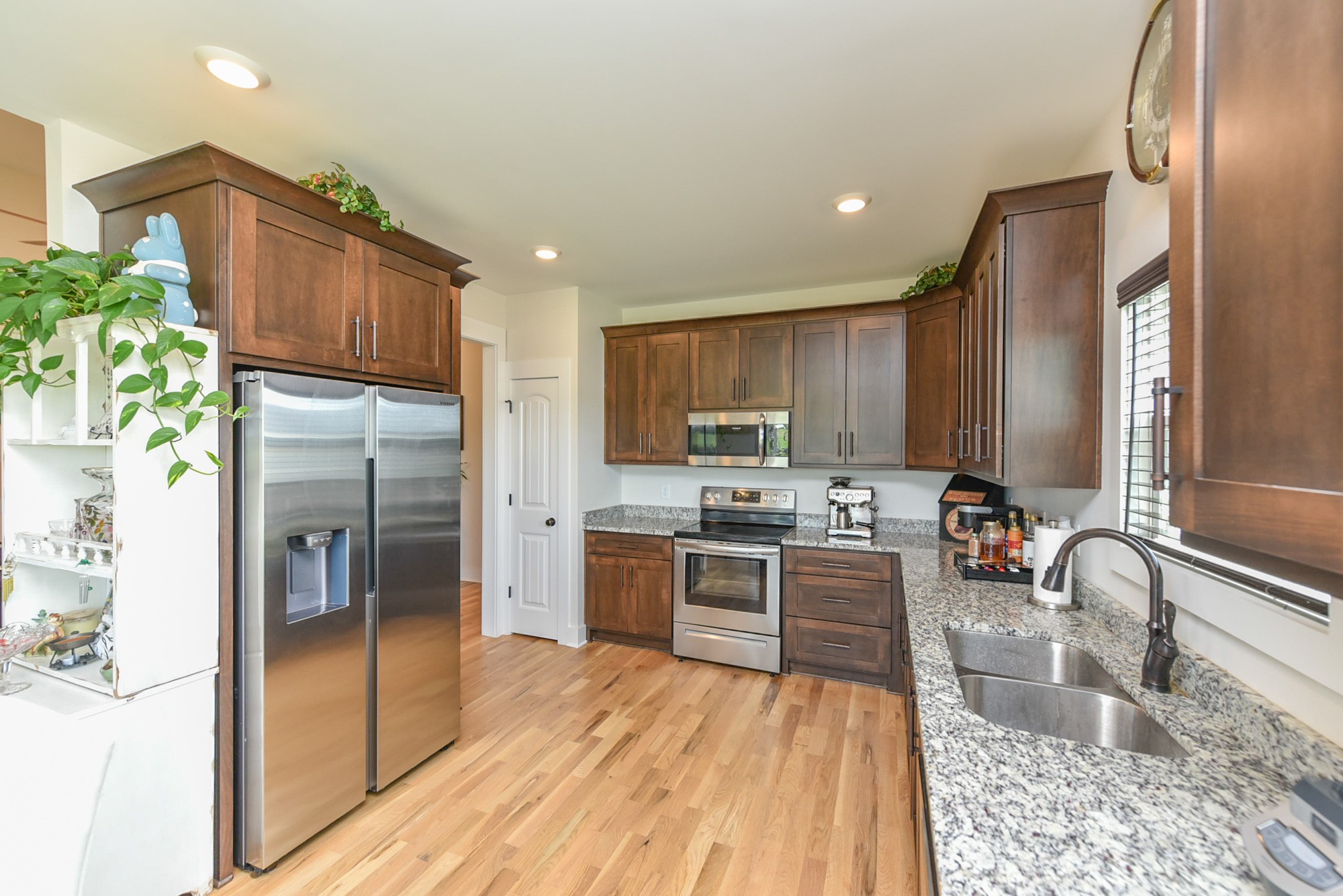 4817 Barren Plains Road Springfield, TN 37172 - Photo 9 of 31 a kitchen with granite countertop stainless steel appliances a refrigerator stove top oven and sink