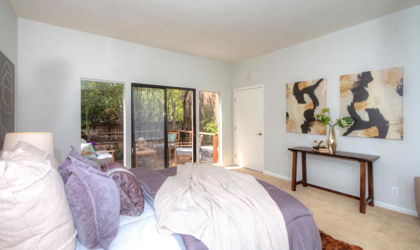 1 Farm Road Los Altos, CA 94024 - Photo 11 of 25 a bedroom with bed and glass window