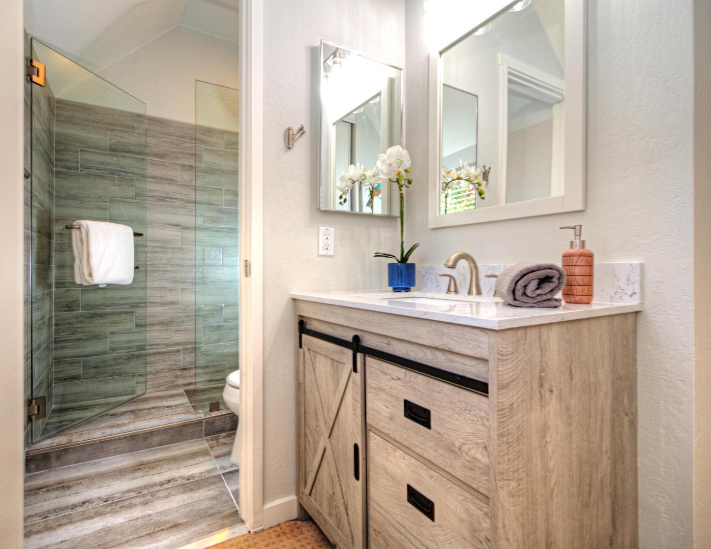 1 Farm Road Los Altos, CA 94024 - Photo 12 of 25 a bathroom with a sink and a mirror