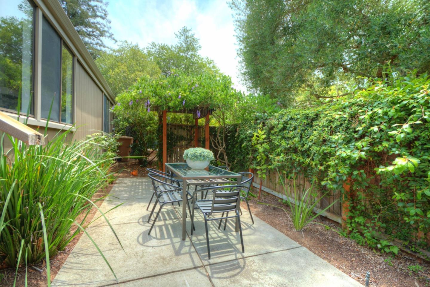 1 Farm Road Los Altos, CA 94024 - Photo 18 of 25 a view of backyard with a patio and outdoor seating