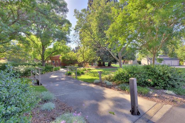 1 Farm Road Los Altos, CA 94024 - Photo 21 of 25 a view of a street with a yard and large trees