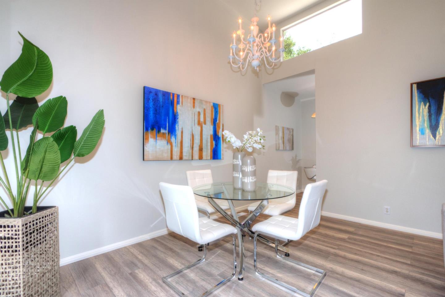 1 Farm Road Los Altos, CA 94024 - Photo 5 of 25 a dining room with furniture potted plants and wooden floor