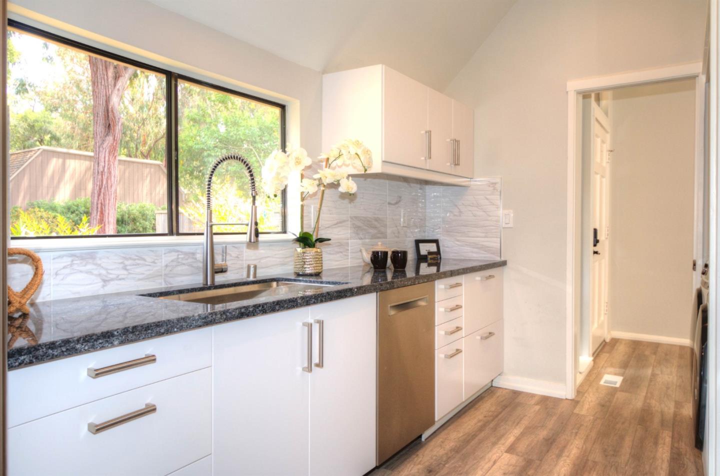 1 Farm Road Los Altos, CA 94024 - Photo 7 of 25 a kitchen with a sink a window and appliances