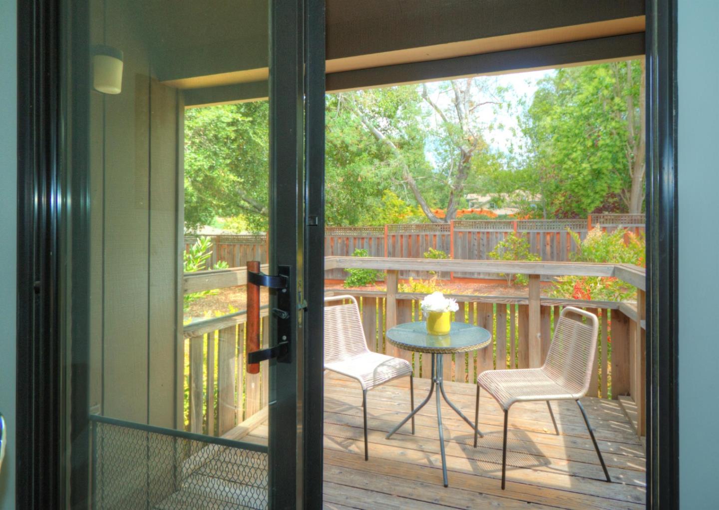 1 Farm Road Los Altos, CA 94024 - Photo 9 of 25 a dining room with furniture and a floor to ceiling window