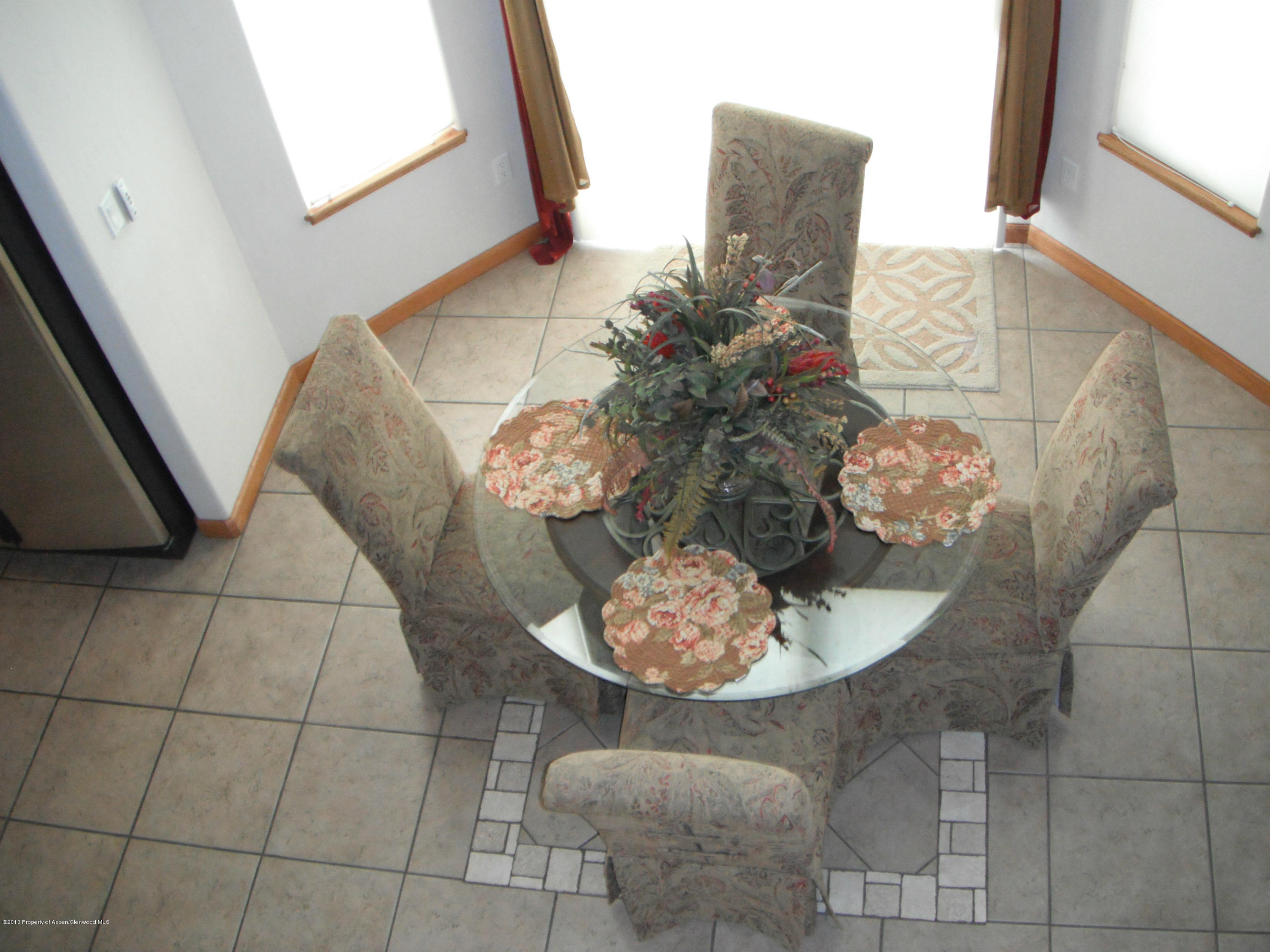 1298 Fir Avenue Rifle, CO 81650 - Photo 21 of 27 a dining room with furniture and wooden floor