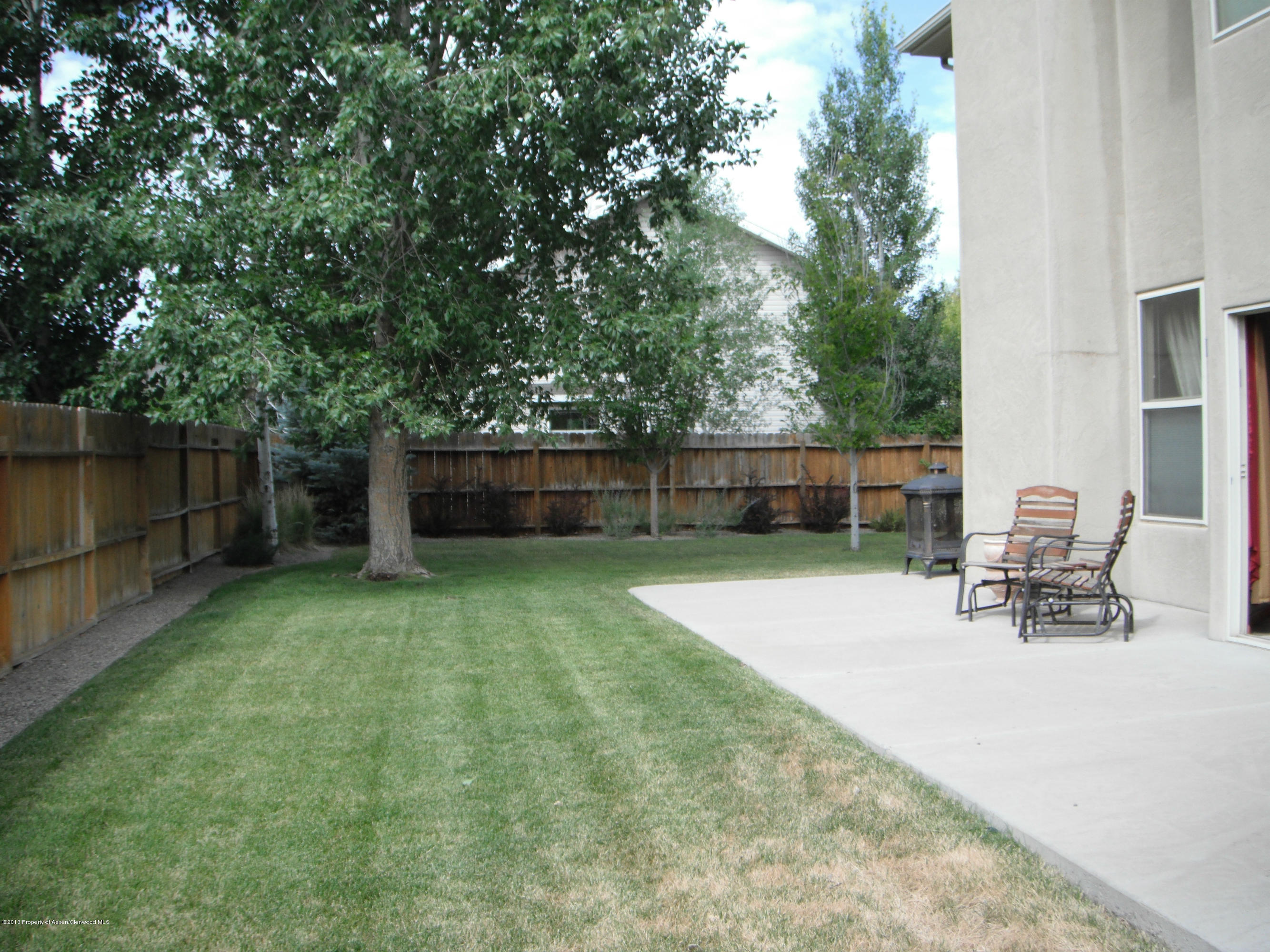 1298 Fir Avenue Rifle, CO 81650 - Photo 23 of 27 a view of a backyard with a table and chairs
