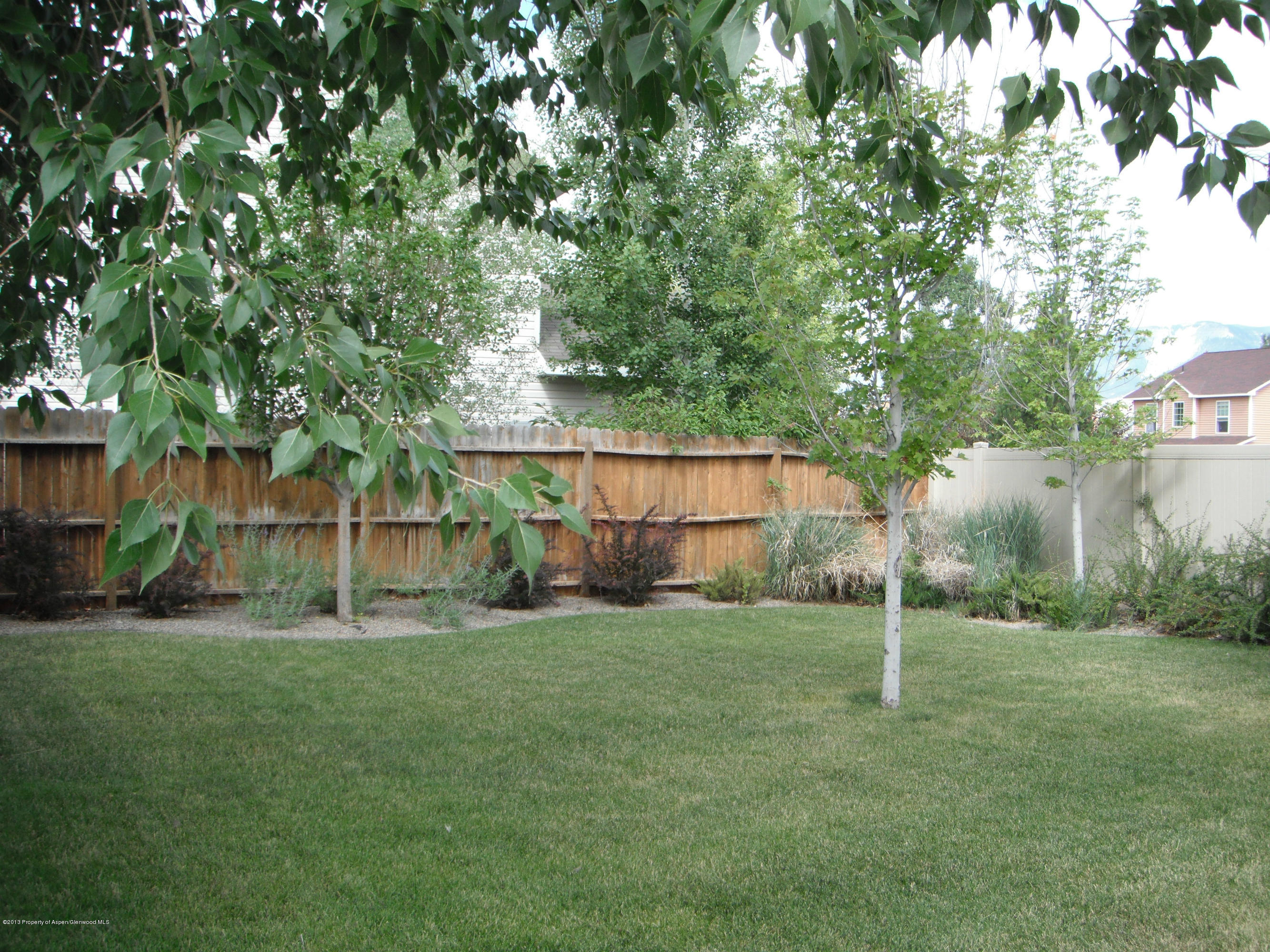 1298 Fir Avenue Rifle, CO 81650 - Photo 24 of 27 a view of a house with a backyard