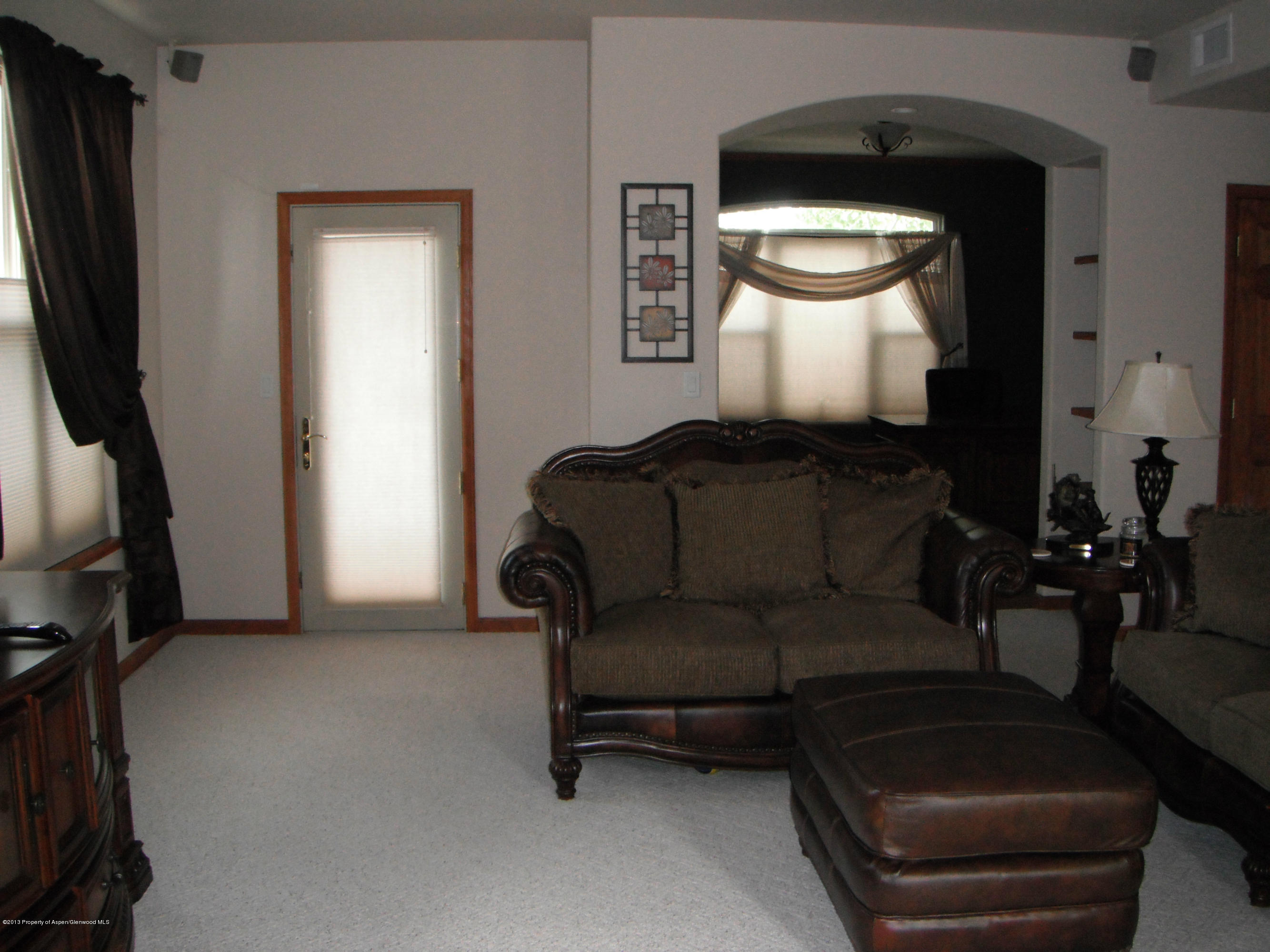 1298 Fir Avenue Rifle, CO 81650 - Photo 7 of 27 a living room with furniture and a window