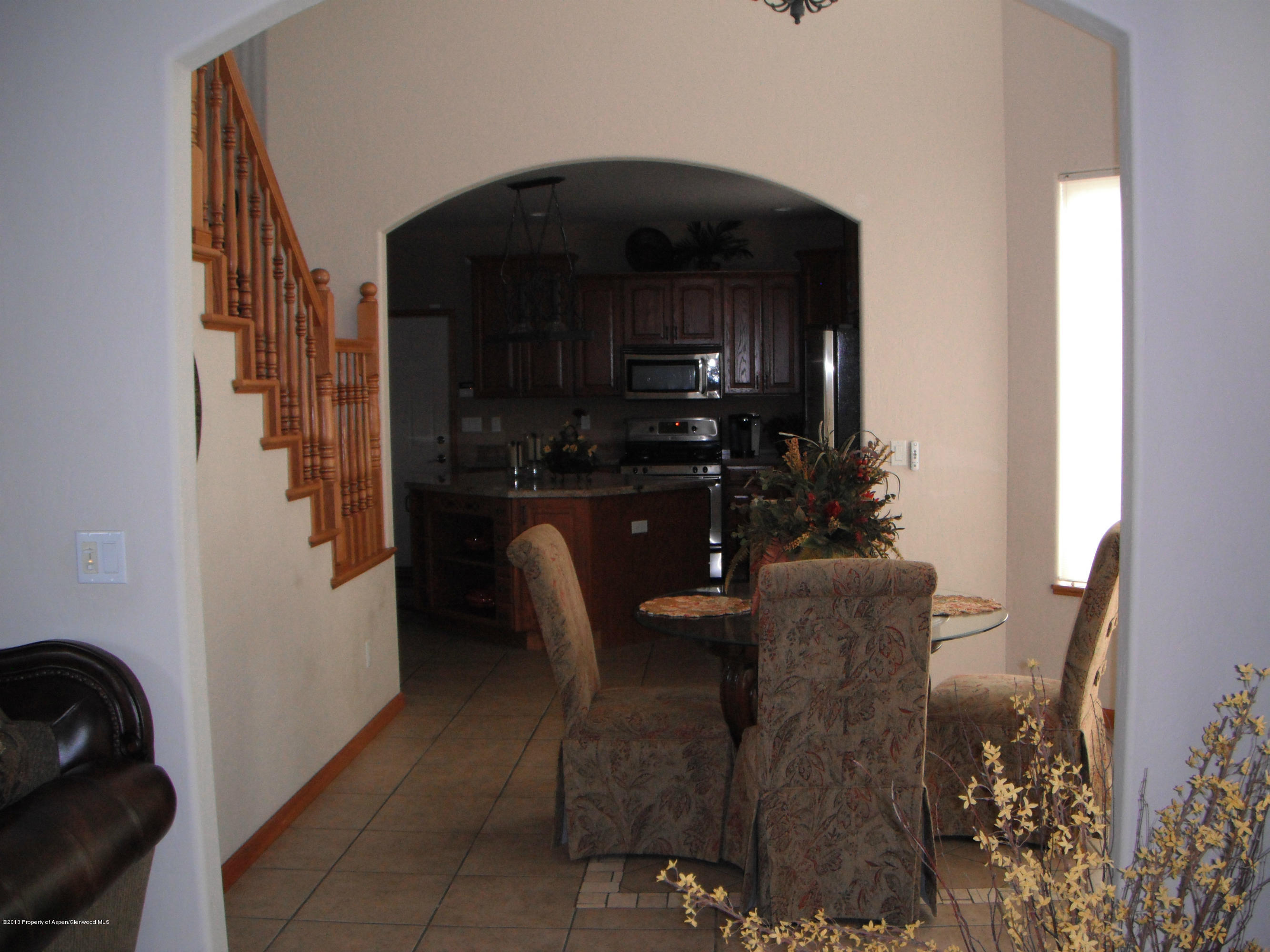 1298 Fir Avenue Rifle, CO 81650 - Photo 8 of 27 a living room with furniture and a potted plant