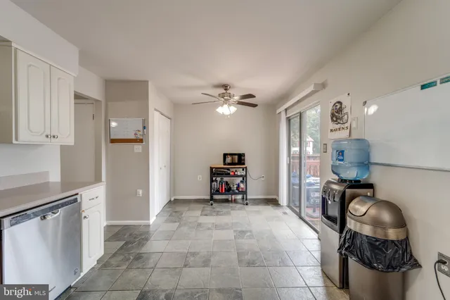 a living room with furniture and a flat tv screen