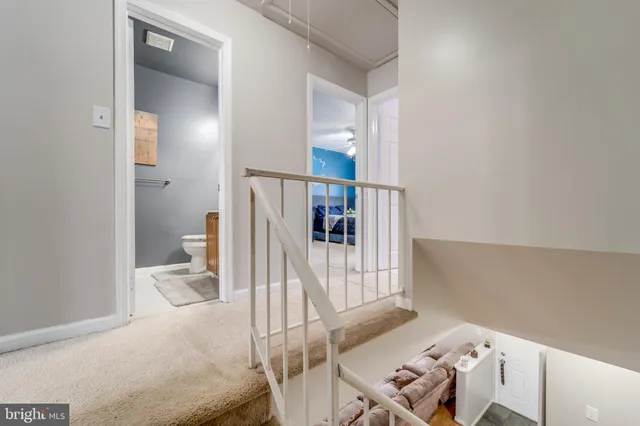 a living room with a bed and furniture