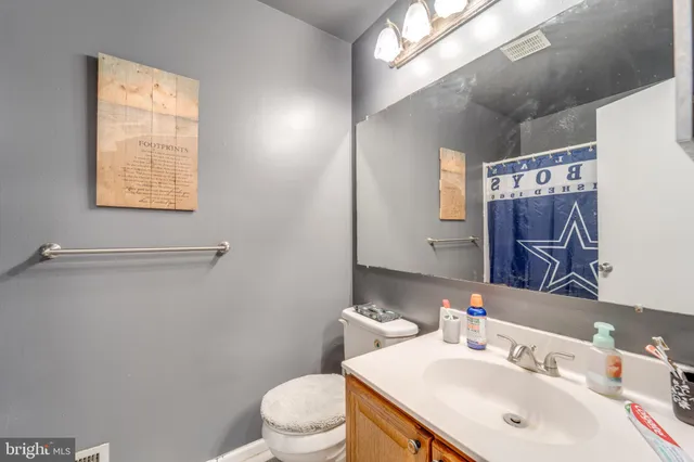 a view of a patio with table and chairs with wooden floor and fence