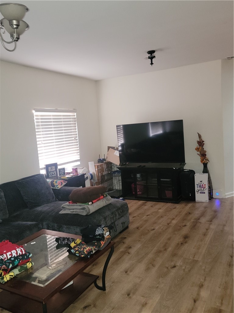 34 53rd Street Long Beach, CA 90805 - Photo 8 of 18 a living room with furniture and a flat screen tv