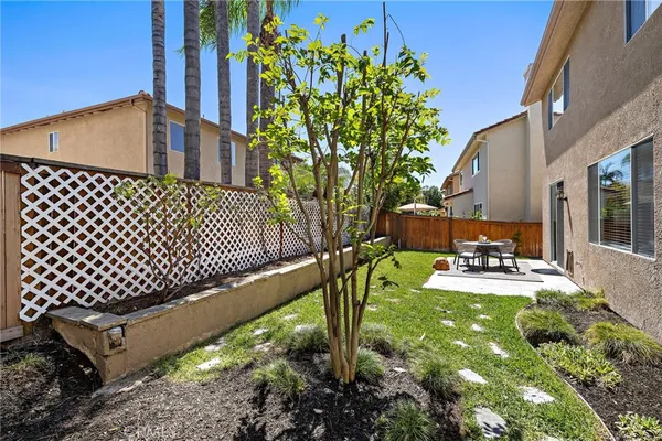 a view of a backyard with sitting area