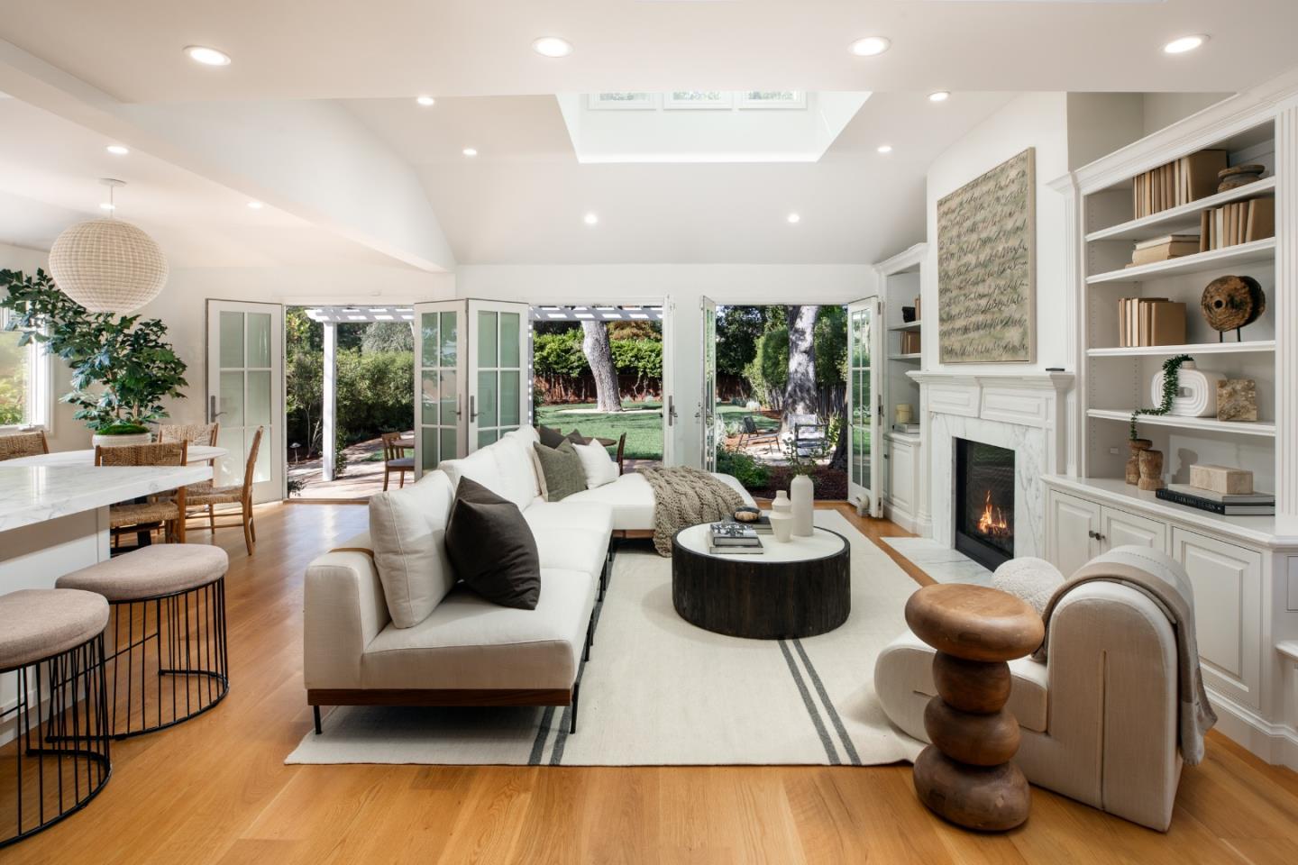90 Macbain Avenue Atherton, CA 94027 - Photo 3 of 19 a living room with fireplace furniture and a large window
