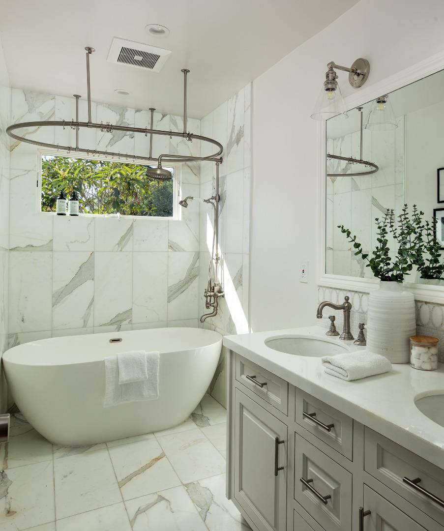 90 Macbain Avenue Atherton, CA 94027 - Photo 10 of 19 a bathroom with a sink and a mirror