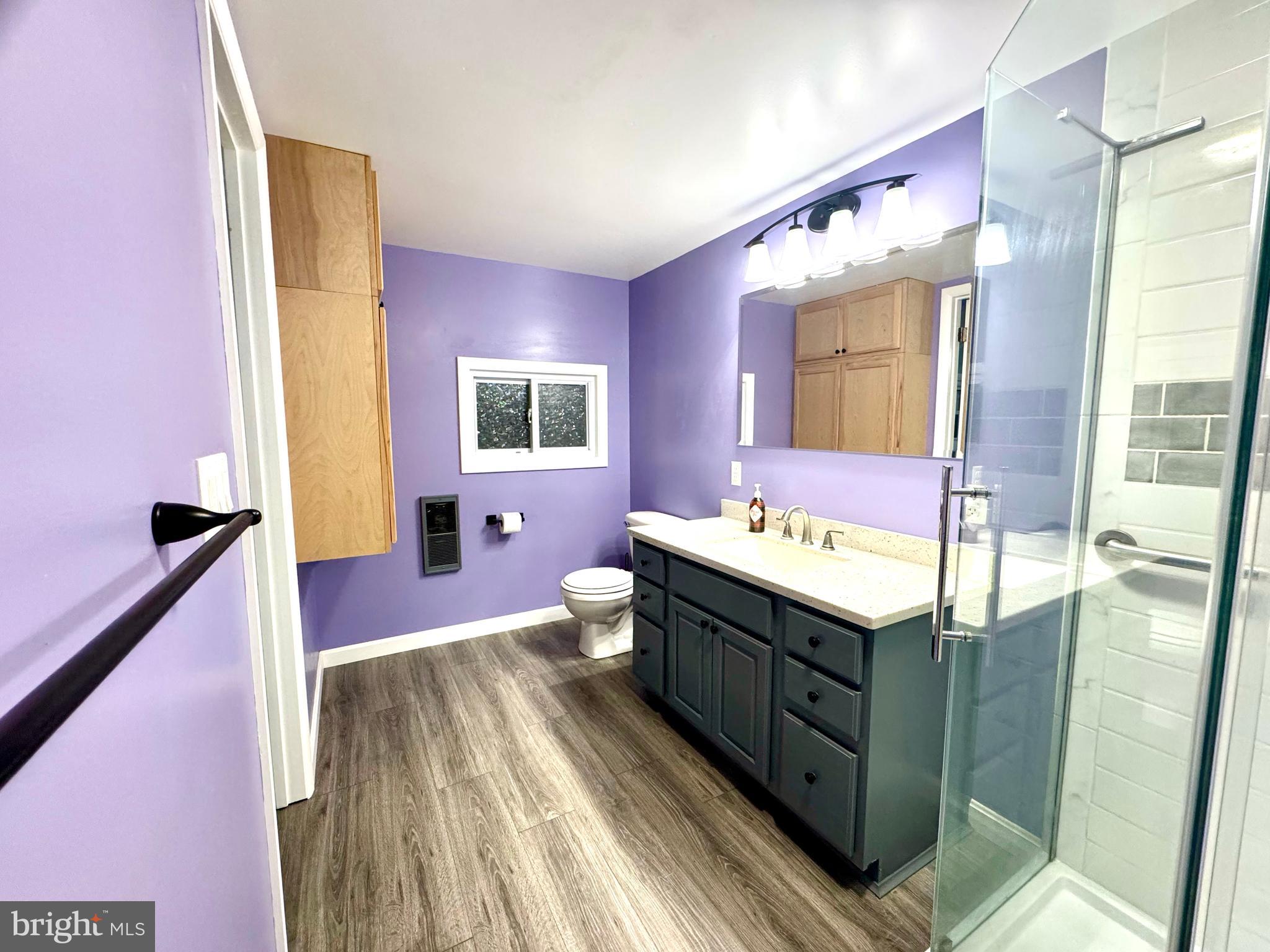 4695 Shelltown Road Marion Station, MD 21838 - Photo 26 of 31 a spacious bathroom with a sink a large mirror and a bathtub
