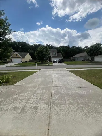a view of an outdoor space and tennis court