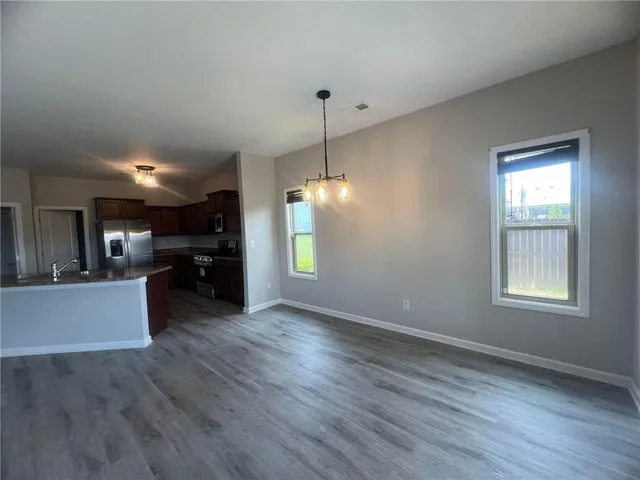 a view of a kitchen and dining room